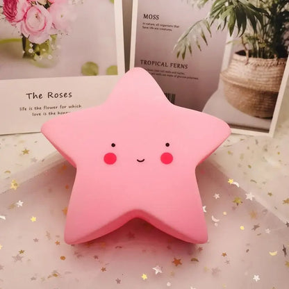 veilleuse bébé étoile rose sur table