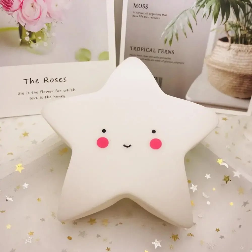 veilleuse bébé étoile blanche sur table