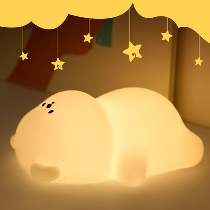 veilleuse bébé ours allonger sur  dos avec ventre potelé