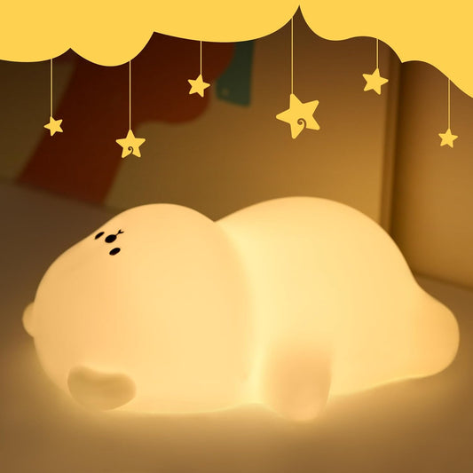 veilleuse bébé ours allonger sur  dos avec ventre potelé